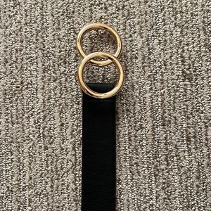 Express belt, size XS, black and gold.